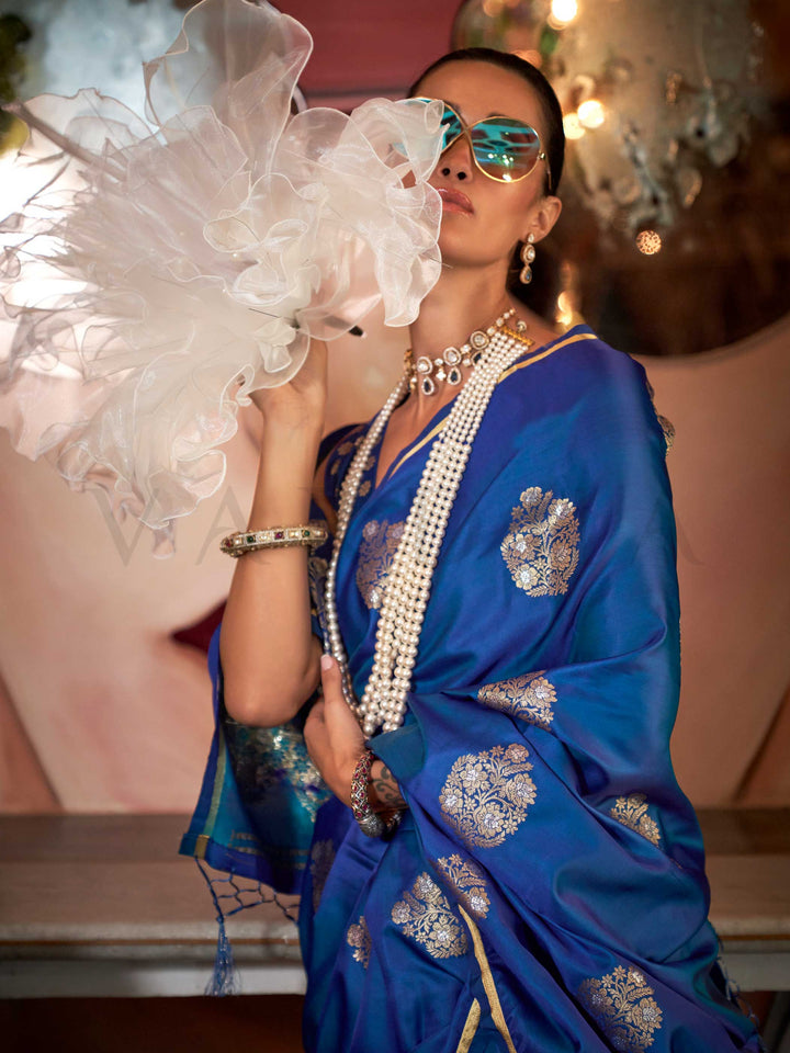 Sapphire Blue satin handloom silk saree with intricate brocade pallu, perfect for weddings and festive occasions This image captures the model styling perspective with complete saree ensemble displayed, ideal for visualizing festive elegance, designer appeal, and modern styling inspiration. Perfect for online shoppers seeking detailed previews before purchase, enhancing saree visual merchandising and SEO-rich product display strategy.