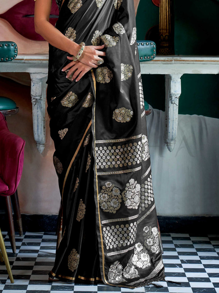 Black Onyx satin handloom silk saree with intricate brocade pallu, perfect for weddings and festive occasions This image captures the back drape focus revealing pallu finesse and motif richness, ideal for visualizing festive elegance, designer appeal, and modern styling inspiration. Perfect for online shoppers seeking detailed previews before purchase, enhancing saree visual merchandising and SEO-rich product display strategy.