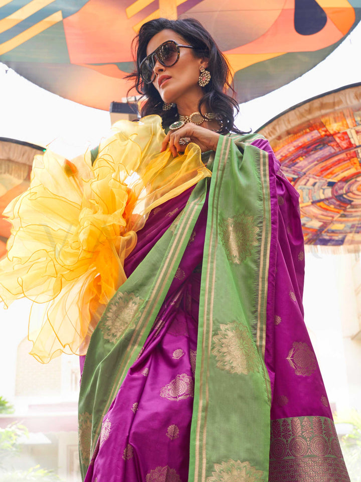 Elegant Magenta–Green silk saree with jacquard weave and mandala inspired border detailing. Magenta–Green saree for weddings and sangeet, finished with artistic zari craftsmanship and rich drape.