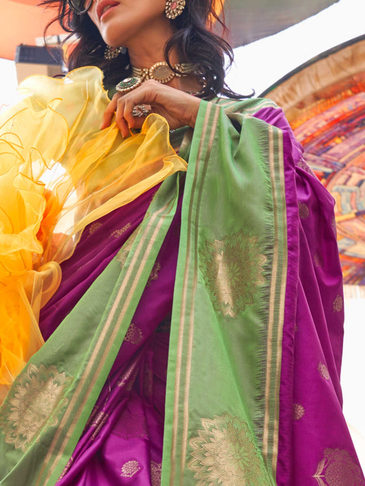 Charming Magenta–Green satin saree with textured pallu and timeless weaving artistry. Traditional-meets-modern in this Magenta–Green saree with zari borders and vibrant festival palette.