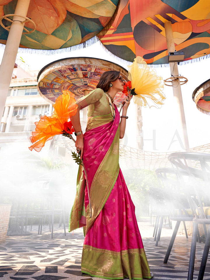 Charming Rani Pink–Leaf Green satin saree with textured pallu and timeless weaving artistry. Traditional-meets-modern in this Rani Pink–Leaf Green saree with zari borders and vibrant festival palette.