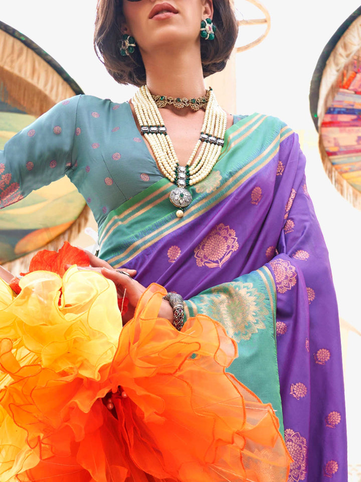 Charming Violet–Parrot Green satin saree with textured pallu and timeless weaving artistry. Traditional-meets-modern in this Violet–Parrot Green saree with zari borders and vibrant festival palette.