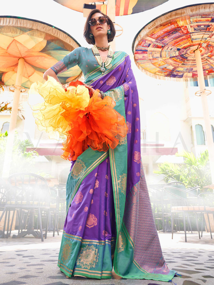 Violet–Parrot Green satin silk saree featuring woven zari mandala motifs, contrast pallu and elegant festive finish. Festive Violet–Parrot Green saree in soft satin silk with intricate weaving and a graceful two-tone blend.