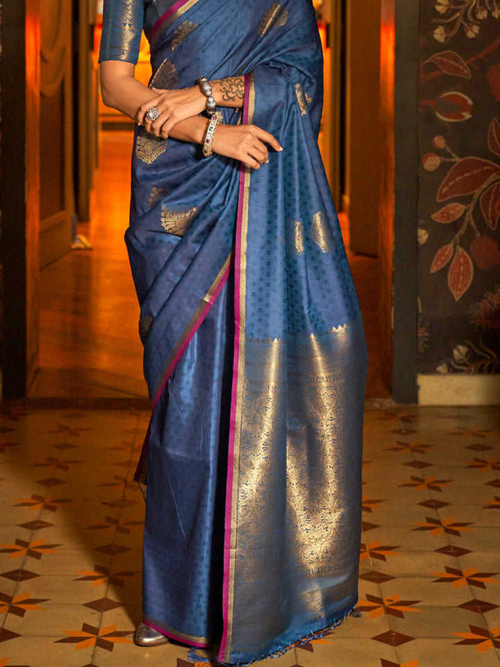 Banarasi satin saree in Midnight Blue–Gold styled with heirloom jewelry and festive decor. Ornate pallu with golden motifs set against Midnight Blue–Gold satin silk for regal presence..