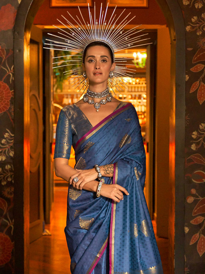 Soft satin silk texture and pleats of Midnight Blue–Gold saree flowing into zari-drenched pallu. Close-up of zari woven motifs on Midnight Blue–Gold banarasi saree with luxurious sheen..