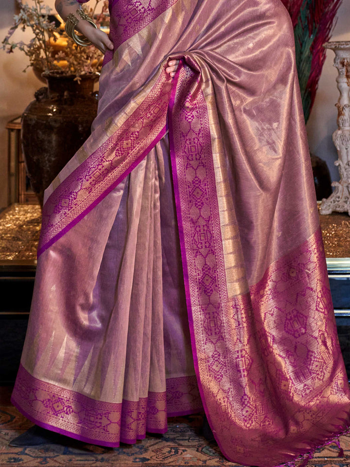 Golden Olive–Crimson Red saree photographed in ornate setting with golden lights and baroque interiors. Soft yet structured fall of Golden Olive–Crimson Red banarasi saree finished with broad ikat zari patterns..