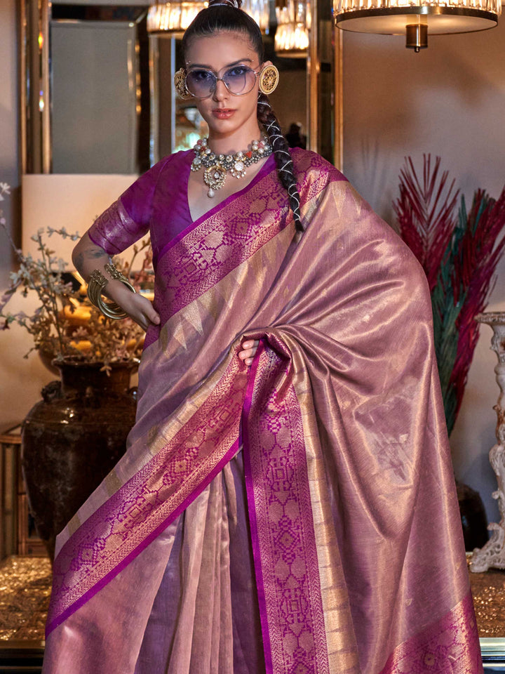 Model draped in Golden Olive–Crimson Red banarasi saree showcasing ikat pallu and heavy tissue silk weave. Intricate zari border and ikat motifs highlighted in Golden Olive–Crimson Red banarasi silk saree with tissue sheen..