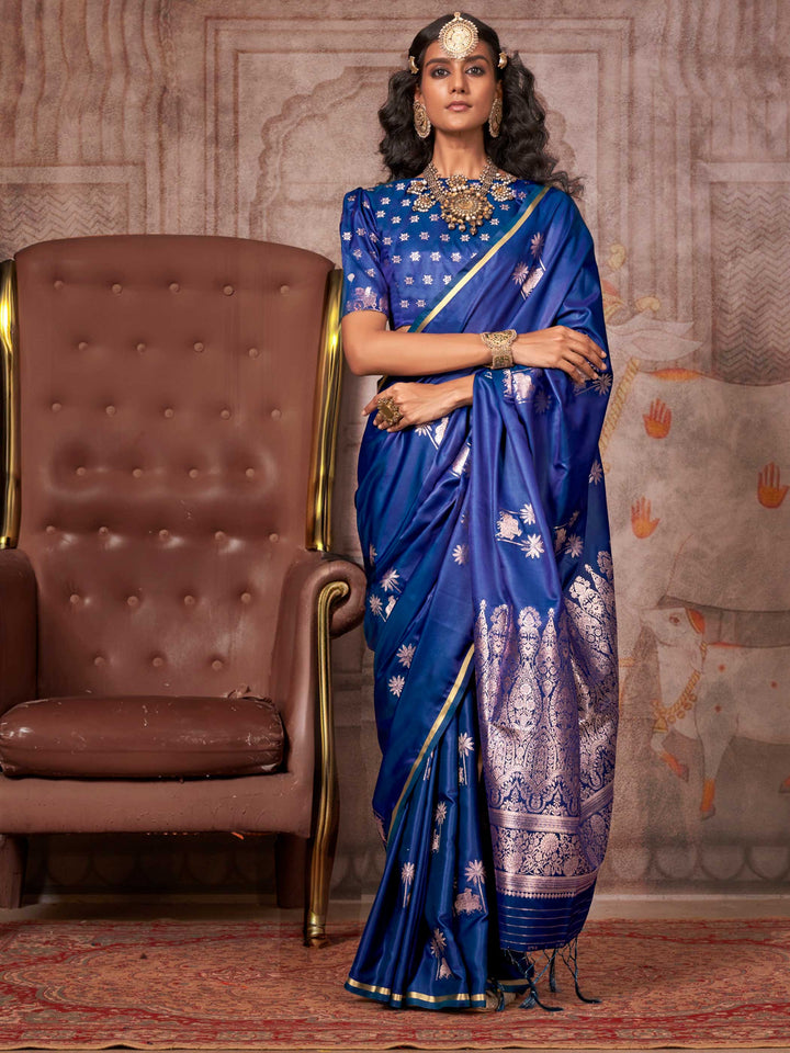 Navy Blue–Rose Gold satin silk saree with jacquard woven motifs and floral zari detailing. Perfect partywear or reception look with embroidered blouse and traditional drape, ideal for festive fashion styling. Navy Blue–Rose Gold satin silk saree with jacquard woven motifs and floral zari detailing. Perfect partywear or reception look with embroidered blouse and traditional drape, ideal for festive fashion styling..