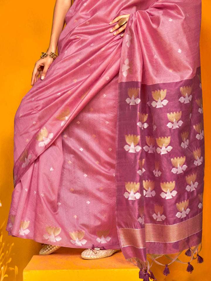 Rose Pink–Grape Purple feathersoft tussar silk saree featuring woven lotus motifs and soft pallu, styled for festive rituals with a breathable finish. Rose Pink–Grape Purple feathersoft tussar silk saree featuring woven lotus motifs and soft pallu, styled for festive rituals with a breathable finish..