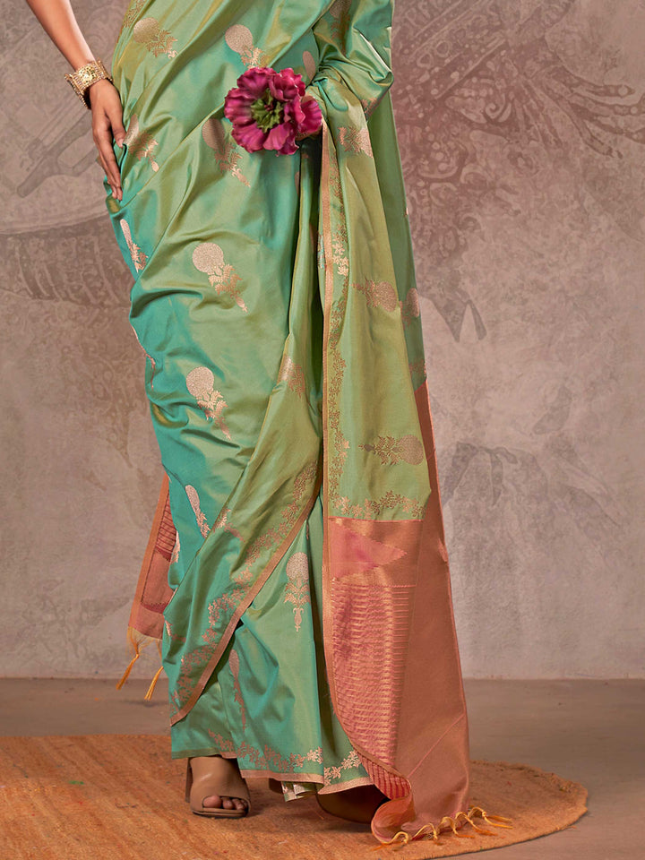 Mint Green–Rose Peach two-tone satin silk saree with woven zari work, styled for bridal wedding ceremonies with jacquard pattern and contrast pallu elegance. Mint Green–Rose Peach two-tone satin silk saree with woven zari work, styled for bridal wedding ceremonies with jacquard pattern and contrast pallu elegance..