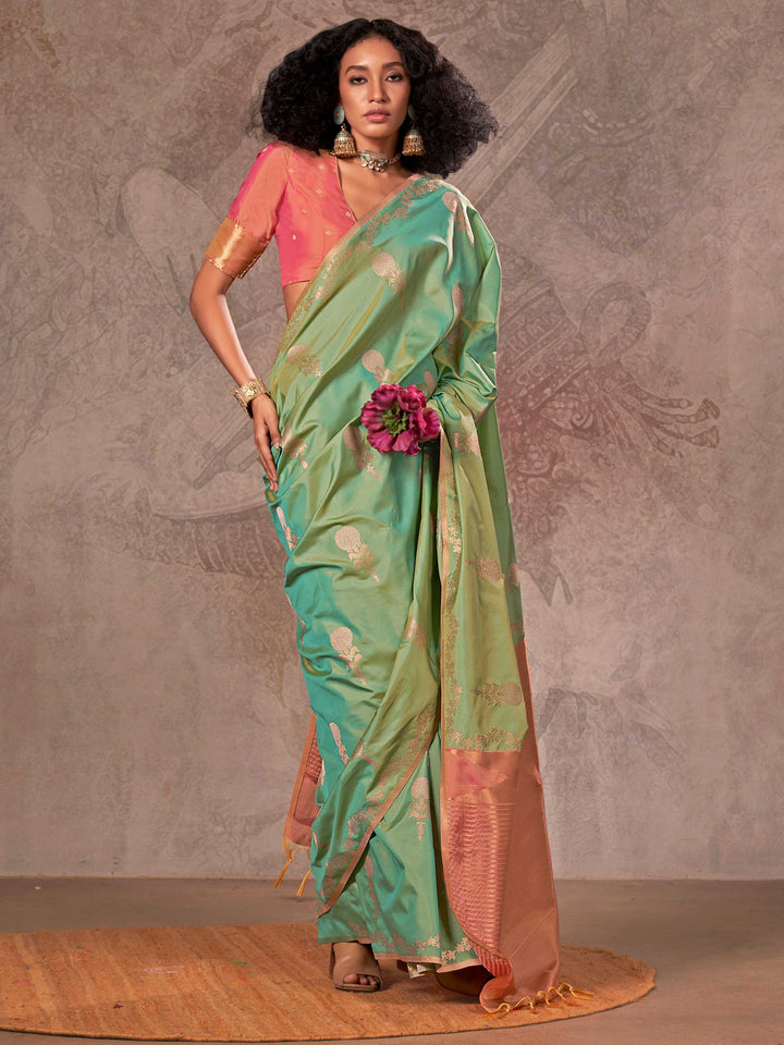 Mint Green–Rose Peach two-tone satin silk saree with woven zari work, styled for bridal wedding ceremonies with jacquard pattern and contrast pallu elegance. Mint Green–Rose Peach two-tone satin silk saree with woven zari work, styled for bridal wedding ceremonies with jacquard pattern and contrast pallu elegance..