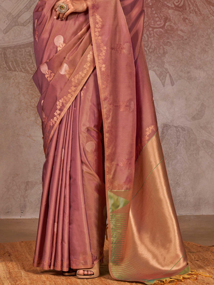 Dusty Rose–Gold Olive two-tone satin silk saree with woven zari work, styled for bridal wedding ceremonies with jacquard pattern and contrast pallu elegance. Dusty Rose–Gold Olive two-tone satin silk saree with woven zari work, styled for bridal wedding ceremonies with jacquard pattern and contrast pallu elegance..