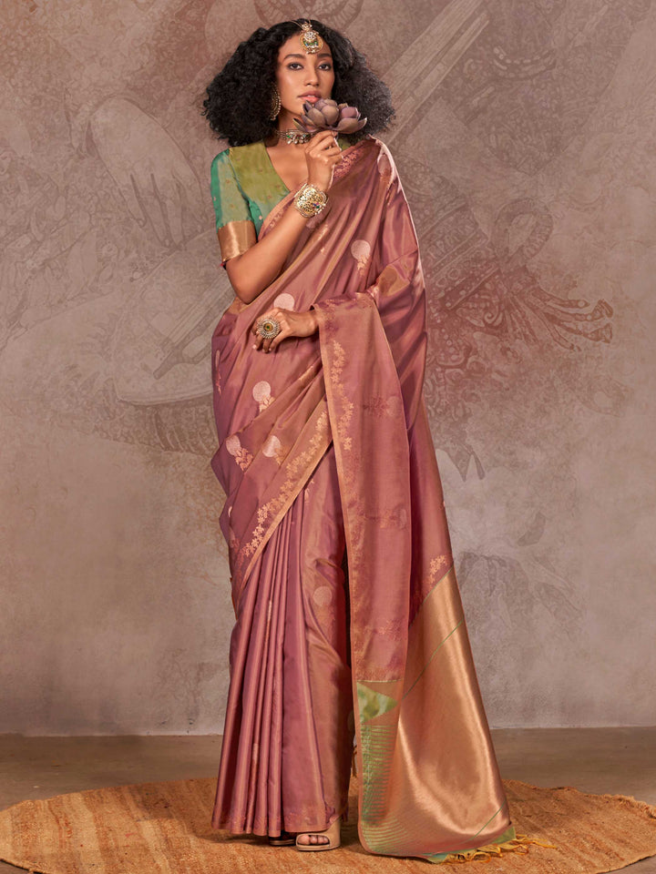 Dusty Rose–Gold Olive two-tone satin silk saree with woven zari work, styled for bridal wedding ceremonies with jacquard pattern and contrast pallu elegance. Dusty Rose–Gold Olive two-tone satin silk saree with woven zari work, styled for bridal wedding ceremonies with jacquard pattern and contrast pallu elegance..