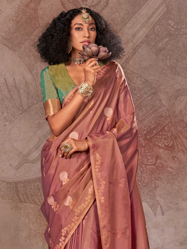 Dusty Rose–Gold Olive two-tone satin silk saree with woven zari work, styled for bridal wedding ceremonies with jacquard pattern and contrast pallu elegance. Dusty Rose–Gold Olive two-tone satin silk saree with woven zari work, styled for bridal wedding ceremonies with jacquard pattern and contrast pallu elegance..