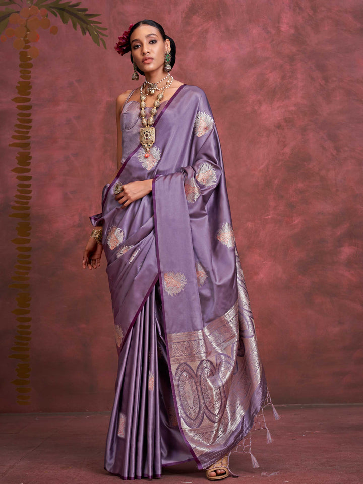 Plum Lavender–Lilac Silver satin silk saree with intricate jacquard zari motifs and metallic pallu, styled for wedding reception and festive bridal evenings with sculpted blouse elegance. Plum Lavender–Lilac Silver satin silk saree with intricate jacquard zari motifs and metallic pallu, styled for wedding reception and festive bridal evenings with sculpted blouse elegance..