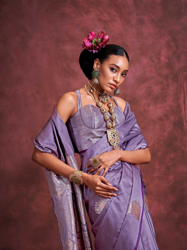 Plum Lavender–Lilac Silver satin silk saree with intricate jacquard zari motifs and metallic pallu, styled for wedding reception and festive bridal evenings with sculpted blouse elegance.