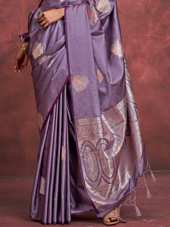 Plum Lavender–Lilac Silver satin silk saree with intricate jacquard zari motifs and metallic pallu, styled for wedding reception and festive bridal evenings with sculpted blouse elegance. Plum Lavender–Lilac Silver satin silk saree with intricate jacquard zari motifs and metallic pallu, styled for wedding reception and festive bridal evenings with sculpted blouse elegance..