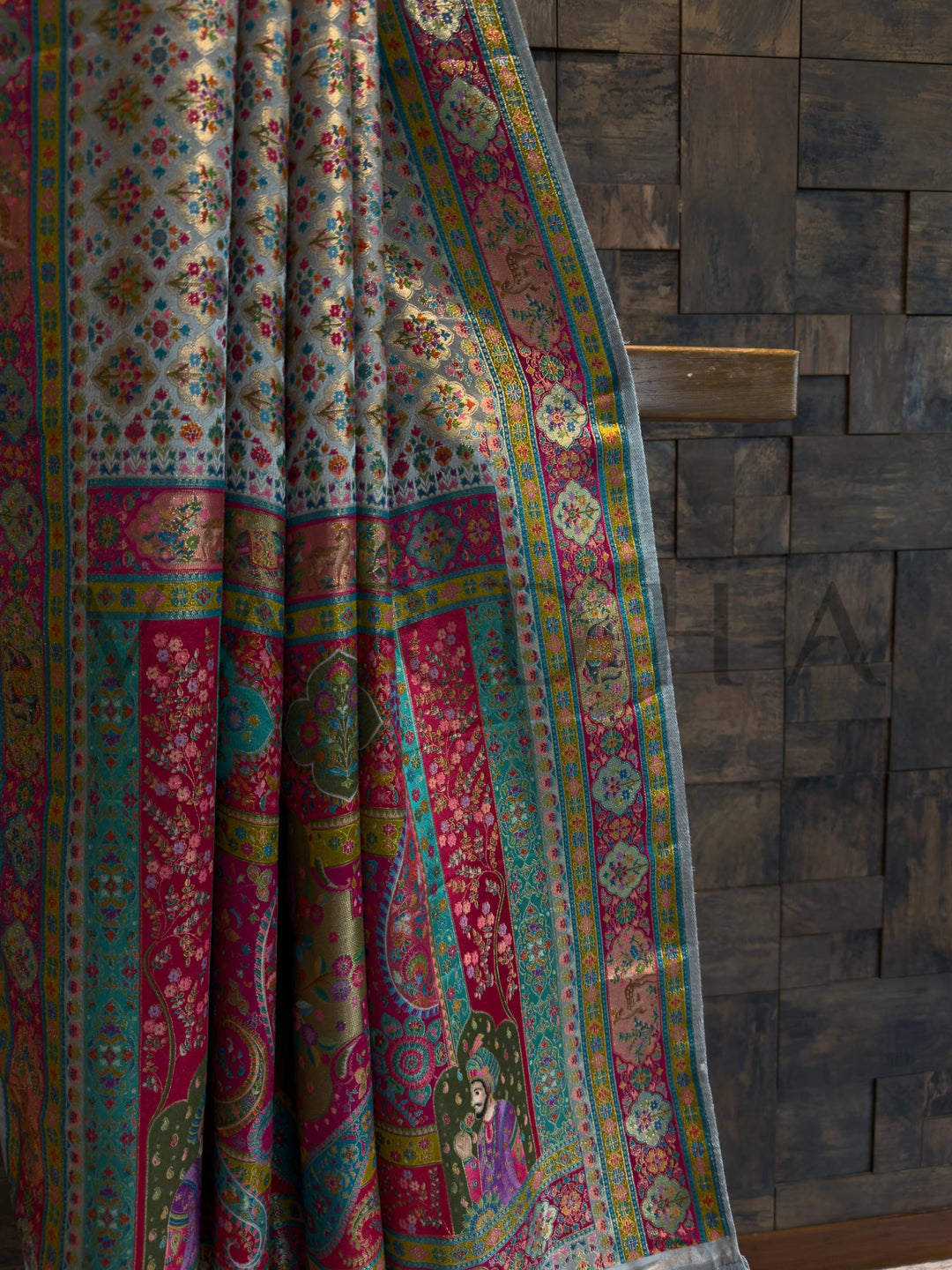 Colorful patterned fabric draped over a wooden surface