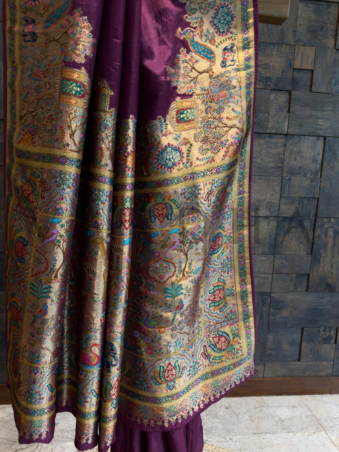 Colorful patterned fabric draped over a wooden surface