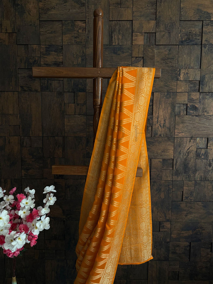 Traditional mustard saree with rich pallu and soft drape for morning pooja