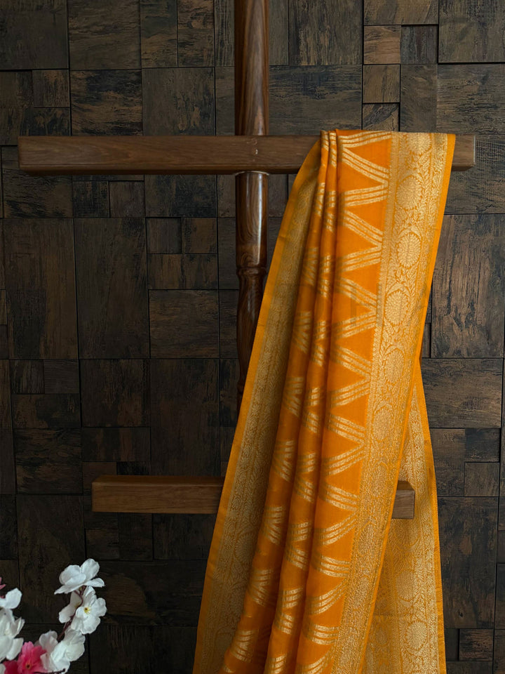 Soft georgette temple wear saree in mustard yellow with unstitched blouse