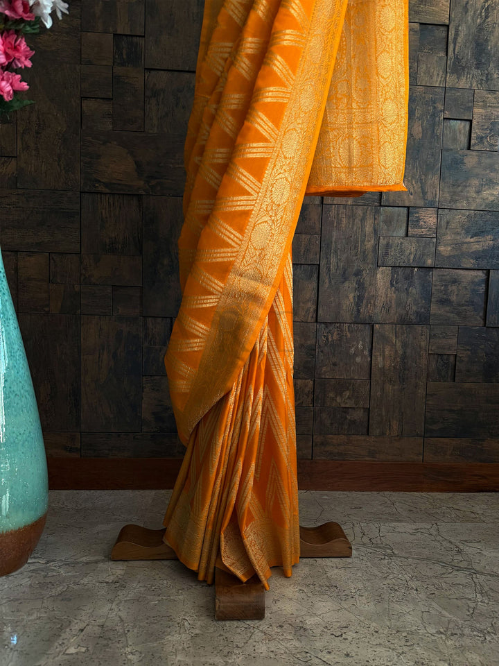 Antique gold woven zari detailing on mustard yellow festive saree