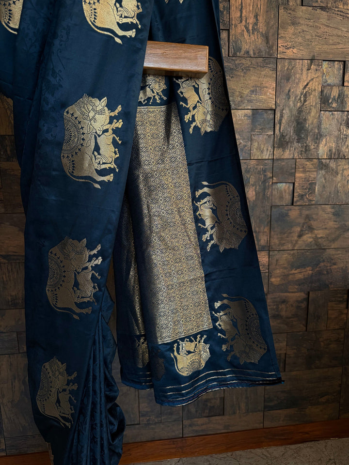 Rich pallu satin saree in dark blue for evening spiritual gatherings