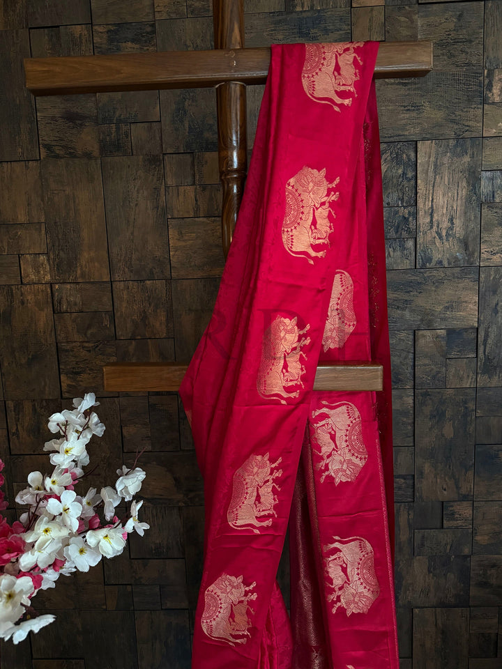 Traditional red satin saree for pooja with classic zari detailing