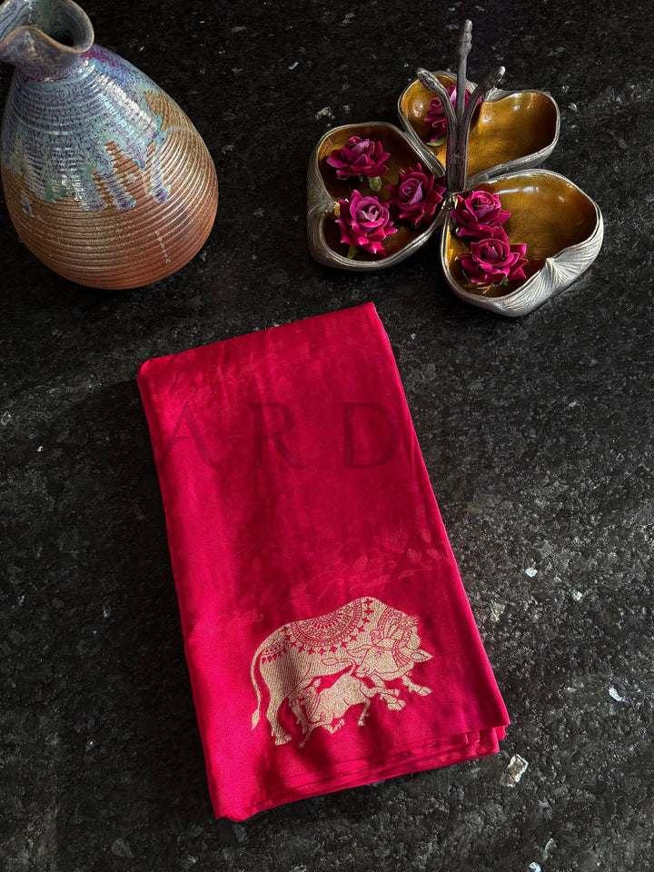 Indian heritage satin saree with elephant motif and glossy finish