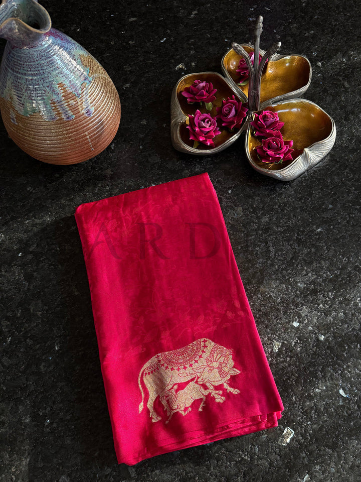 Ceremonial satin saree in red with golden zari accents