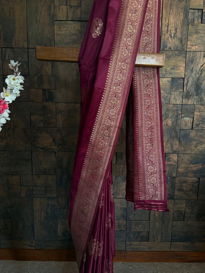 Glossy maroon saree ideal for rituals and engagement ceremonies
