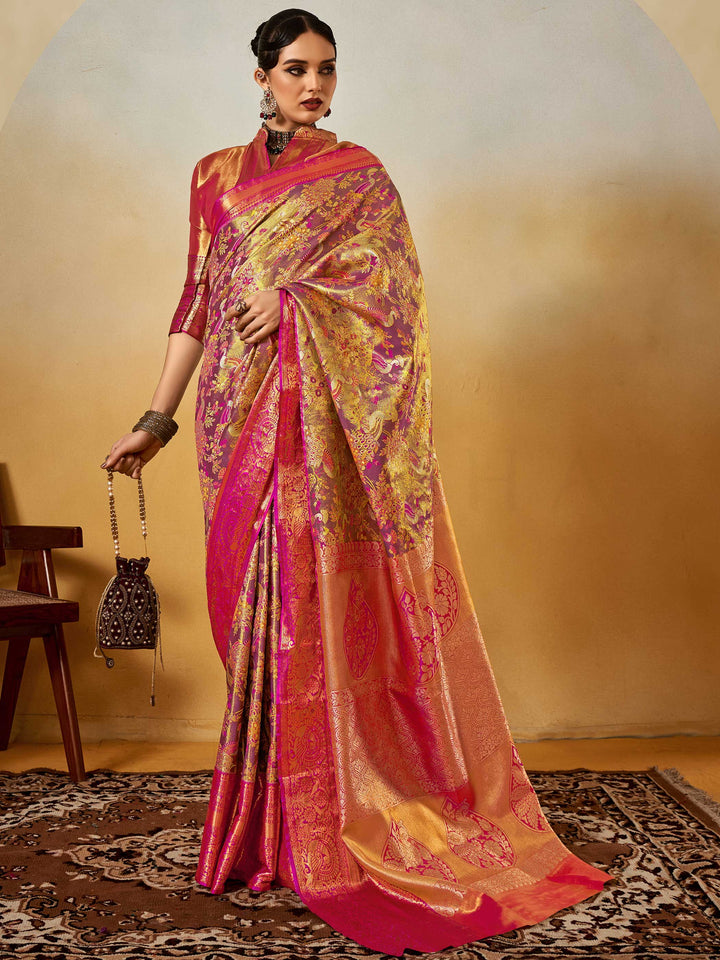 Magenta–Gold Banarasi satin silk saree with zari work and woven parrot motifs, styled for traditional Indian wedding rituals with luxury finish. Magenta–Gold Banarasi satin silk saree with zari work and woven parrot motifs, styled for traditional Indian wedding rituals with luxury finish..