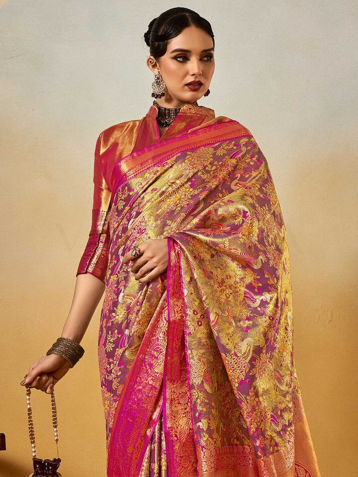 Magenta–Gold Banarasi satin silk saree with zari work and woven parrot motifs, styled for traditional Indian wedding rituals with luxury finish. Magenta–Gold Banarasi satin silk saree with zari work and woven parrot motifs, styled for traditional Indian wedding rituals with luxury finish..
