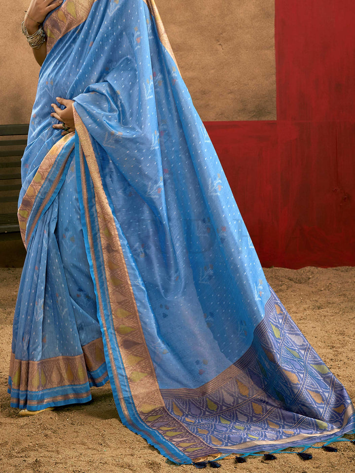 Sky Blue–Periwinkle Blue Banarasi silk saree with Patola-inspired design and rich zari border, styled for wedding glamour and traditional elegance. Sky Blue–Periwinkle Blue Banarasi silk saree with Patola-inspired design and rich zari border, styled for wedding glamour and traditional elegance..