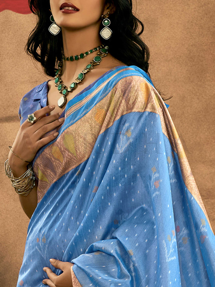 Sky Blue–Periwinkle Blue Banarasi silk saree with Patola-inspired design and rich zari border, styled for wedding glamour and traditional elegance. Sky Blue–Periwinkle Blue Banarasi silk saree with Patola-inspired design and rich zari border, styled for wedding glamour and traditional elegance..