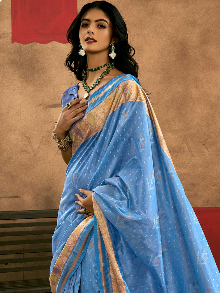 Sky Blue–Periwinkle Blue Banarasi silk saree with Patola-inspired design and rich zari border, styled for wedding glamour and traditional elegance. Sky Blue–Periwinkle Blue Banarasi silk saree with Patola-inspired design and rich zari border, styled for wedding glamour and traditional elegance..