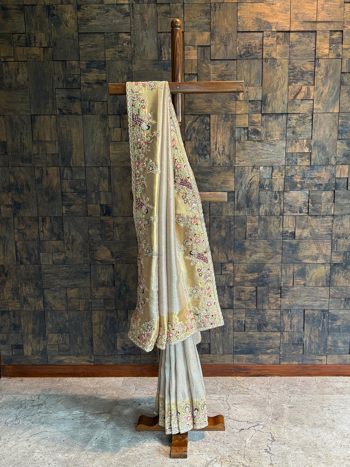 Chiku Kanjivaram Tissue Silk Saree with hand embroidered peacock and floral zari border