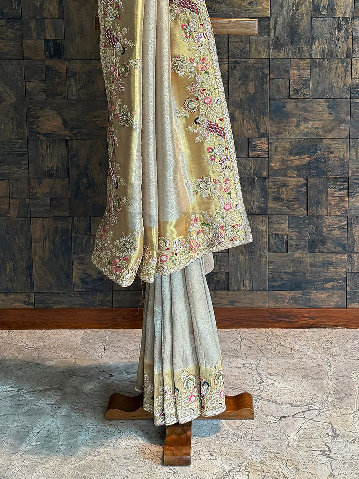 Regal chiku silk saree with scalloped lace and zari floral detailing for festive occasions