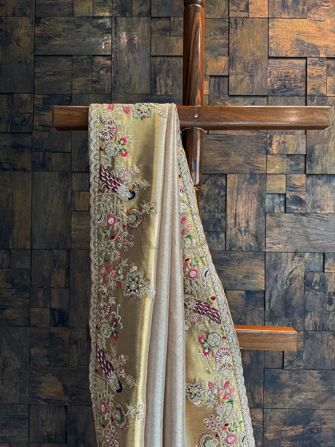 Wedding-ready embroidered saree with sequins, resham, and zari highlights on chiku base