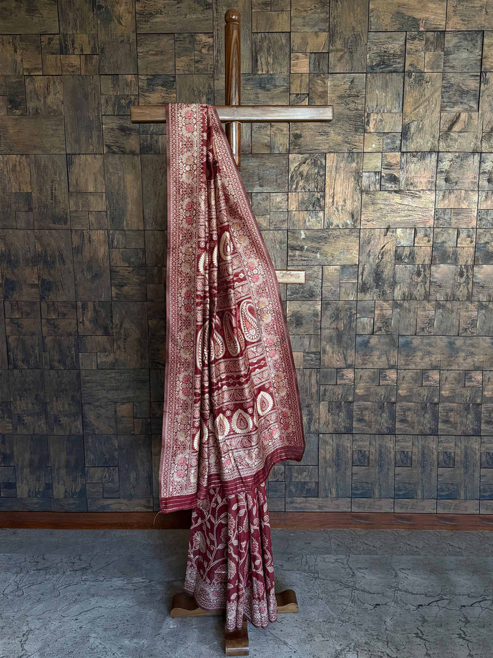 Crimson Maroon Lucknowi Chikankari Silk Saree featuring Intricate Weaving and an Entrancing Blouse, ideal for Festive Occasions and Cultural Celebrations.