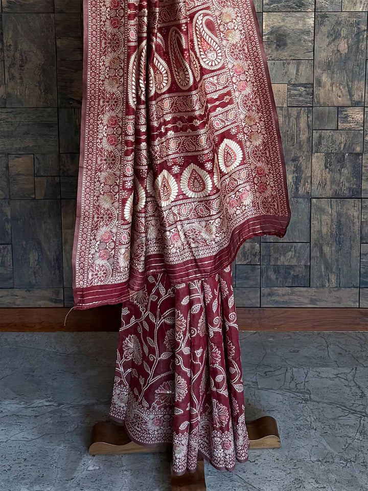 Handcrafted Maroon Chikankari Saree with Detailed Floral Patterns and an Entrancing Blouse, showcasing Authentic Lucknowi Craftsmanship for Elegant Parties.