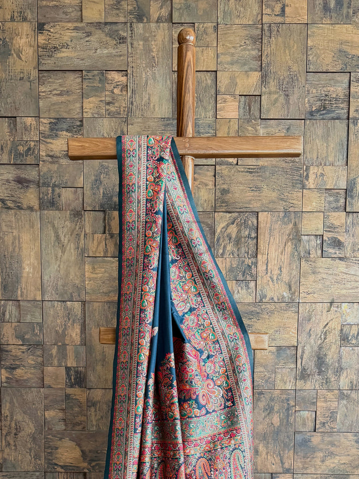 Denim blue raw silk saree with a soft Pashmina texture and intricate embossed thread work, perfect for a timeless look.