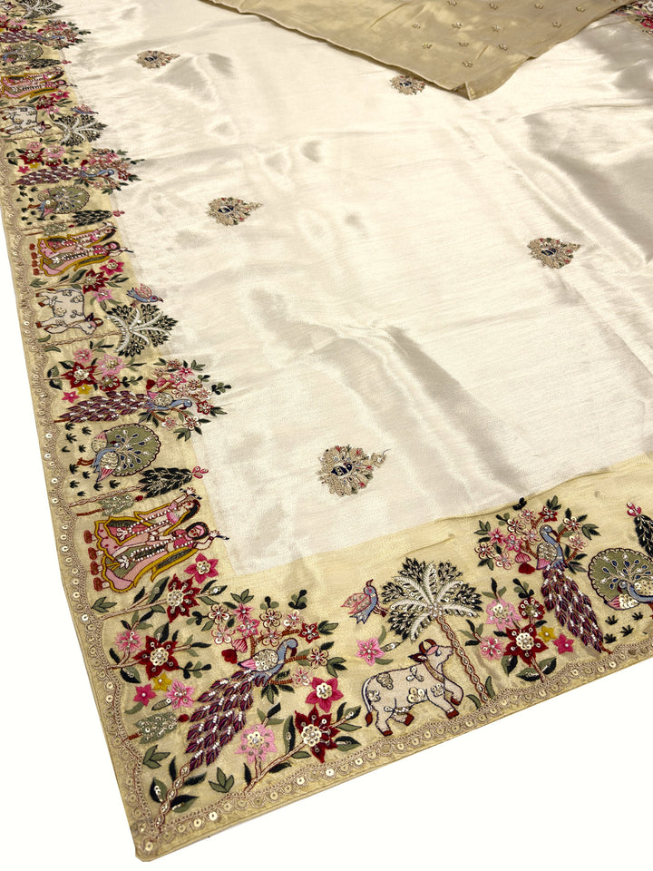 Embroidered fabric with floral and peacock designs on a white background