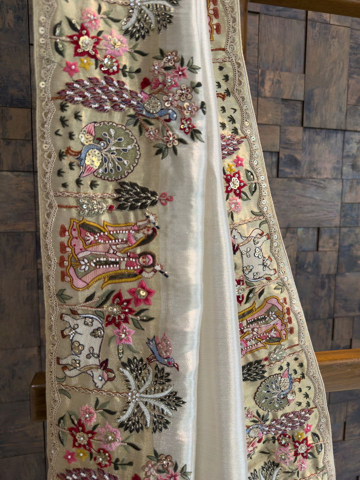 Decorative fabric with intricate embroidery and patterns on a wooden surface