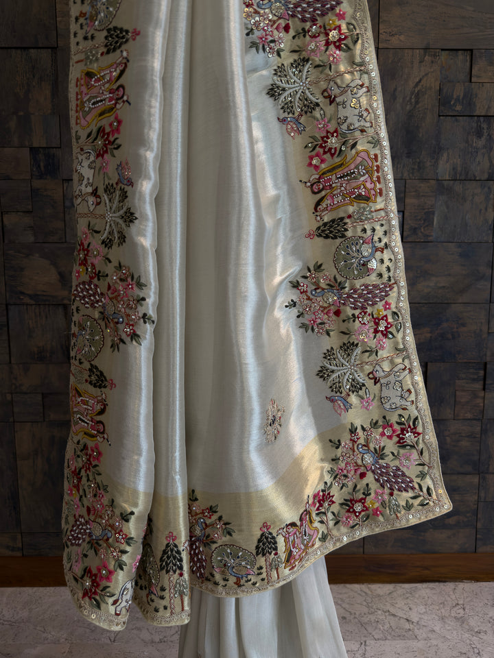 White embroidered garment against a wooden paneled background