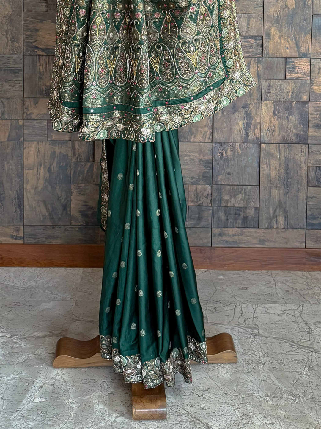 Elegant emerald green Banarasi Jamawar saree in satin silk, adorned with intricate hand embroidery for a timeless appeal.