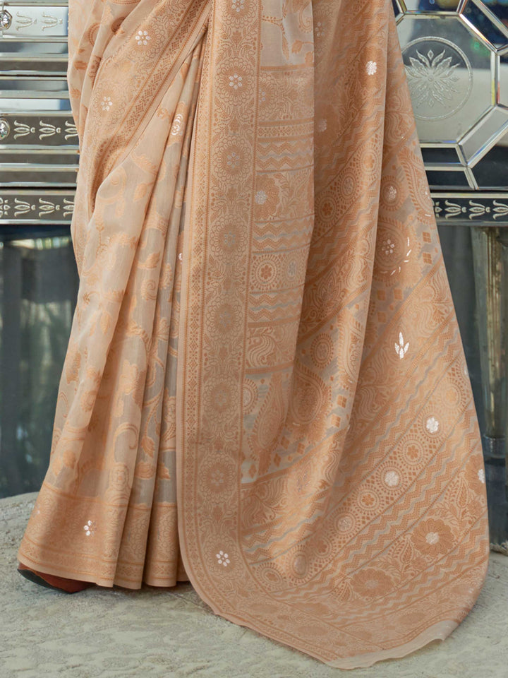 Elegant French Beige Chikankari Georgette Saree adorned with Intricate Lucknowi Weaving, perfect for Bridal Wear and Cultural Celebrations.