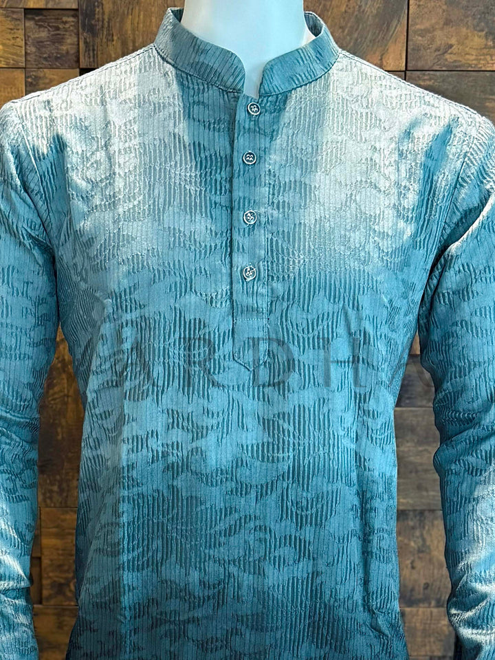 Blue patterned shirt on a mannequin against a wooden background