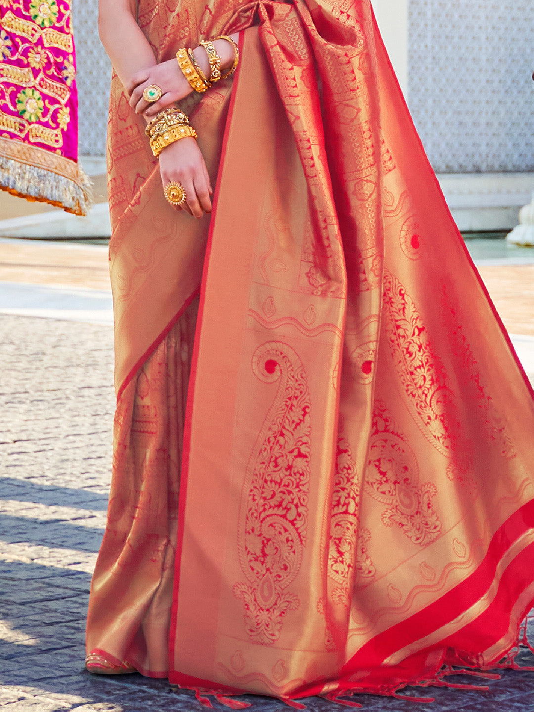Opulent kanjivaram weave in Maroon–Gold silk, styled with contrast blouse and pallu. South Indian inspired bridal saree in Maroon–Gold with glossy texture and rich borders.