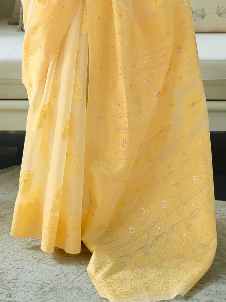 Handcrafted Lemon Yellow Chikankari Cotton Saree with Allover Jaal Embroidery and a Coordinated Blouse, offering a Graceful Drape for Traditional Events.